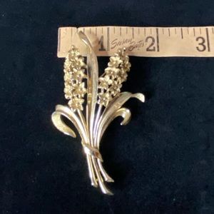 Large vintage crown Trifari brooch. Lilac flowers.